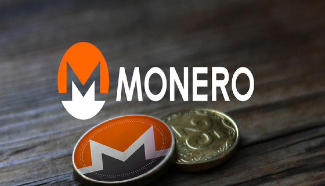Monero coin and gold coin on the table